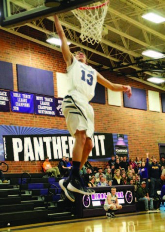 East Grand senior Brad Lutz (#13) dunks in the game against Platte Canyon. The Panthers won. photo credit Chad Fossen