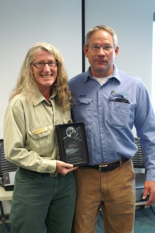 USFS Wildlife Biologist Doreen Sumerlin awarding MPE Operations Superintendent Bruce Van Bockern the Wings across America Award.