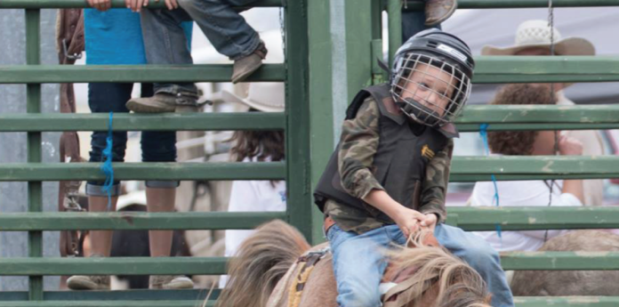 The Middle Park Fair and Rodeo provides enjoyment for all ages. The popular mini broncs for younger bronc riders make a return to the fair line-up again this year. photo by Kim Cameron