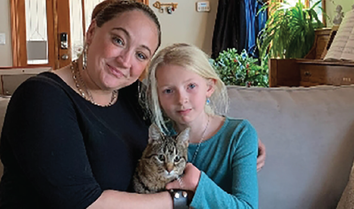 Amanda and Samantha Simmons hold their new cat, Peaches during an interview with Channel 4 earlier this month.