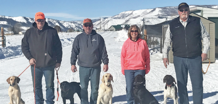 (L to R) Todd Perdue with Lilly & Bailey (yellow & black labs), Carl Prather with Morgan, the 