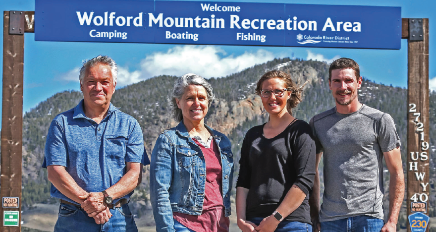 photo by Mike Wilson | Welcome the new faces of Wolford; Doug, Kristin, Brittany, and Bryan Klot are Grand County at its finest. Amidst this challenging time they hope to have the campground and the full service marina open by Memorial Day Weekend. Interestingly, the thrust fault present on Wolford Mountain in the background is unique to Wolford and formed during the late Cretaceous period approximately 90 million years ago.