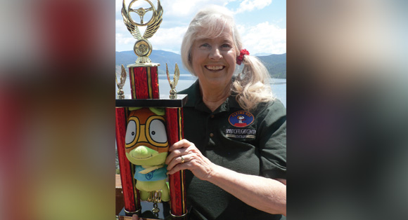 Dr. Penny Rafferty Hamilton was surprised and honored to be chosen for the 2020 Spirit of Flight Award. AVEE, our SOF mascot, proudly adorns her classic trophy.