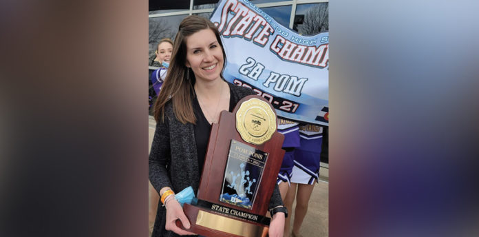 West Grand Spirit Team Coach Kendra Holmes with the State 2A Championship Trophy. After her team’s performance, Coach Holmes waited by herself for the announcement they had won! The trophy now has a home at the West Grand High School the showcase near the office.
