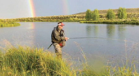 photo by Mark Adams | DOUBLE RAINBOW Fishing guide, Bob Dye fishes on Troublesome Creek a few years ago.