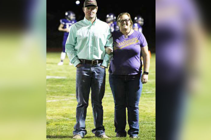Photo by Dezarae Wolf Each Homecoming royalty candidate chose someone to honor at the football candidate. Senior Trace Lewis chose Ms. Emmylou Harmon for her positive impact on his life.