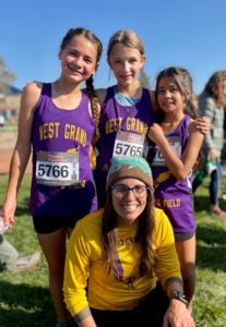 Coach-Mead-with-her-West-Grand-Middle-School-runners-from-left-to-right-Teaari-Luna-Elizabeth-George-Yaretzi-Aguilar-Pineiro.-Photo-Credit-Laura-Luna-