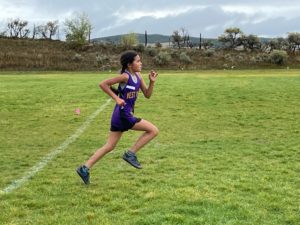 Yaretzi-Aguilar-Pineiro-sprints-to-the-finish-line-at-the-Districts-meet-in-Meeker.-Photo-Credit-Laura-Luna
